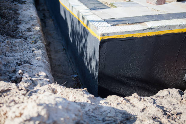 Professional Basement Waterproofing technician working in Tellico Plains, TN